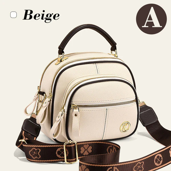 Bolso clásico multifuncional con compartimentos ajustables y correa ancha para el hombro.