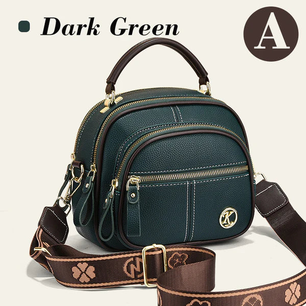 Bolso clásico multifuncional con compartimentos ajustables y correa ancha para el hombro.